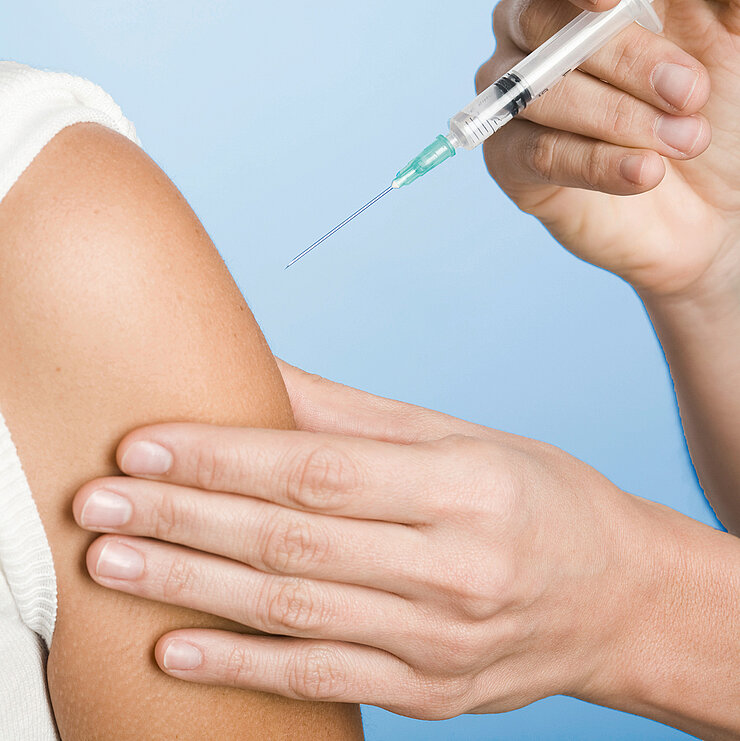 Vaccination of a person by needle