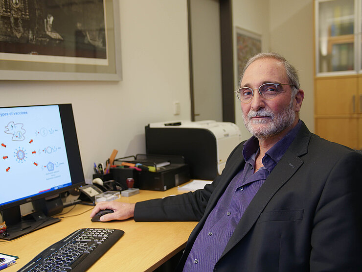 Carlos A. Guzmán at his computer