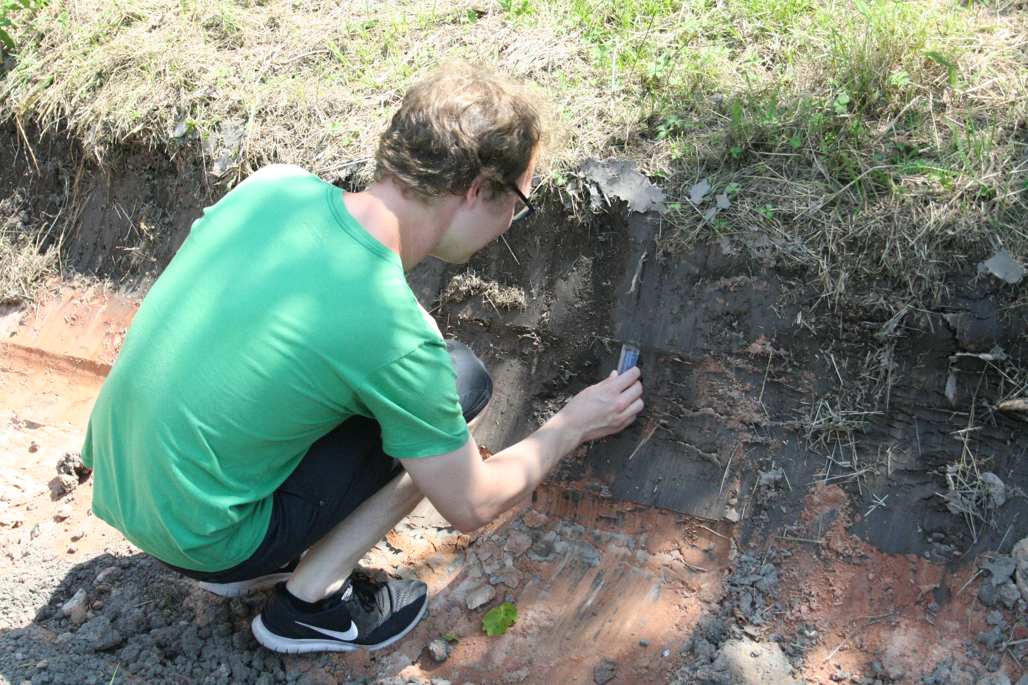 Master student Julian Thimm collects a soil sample